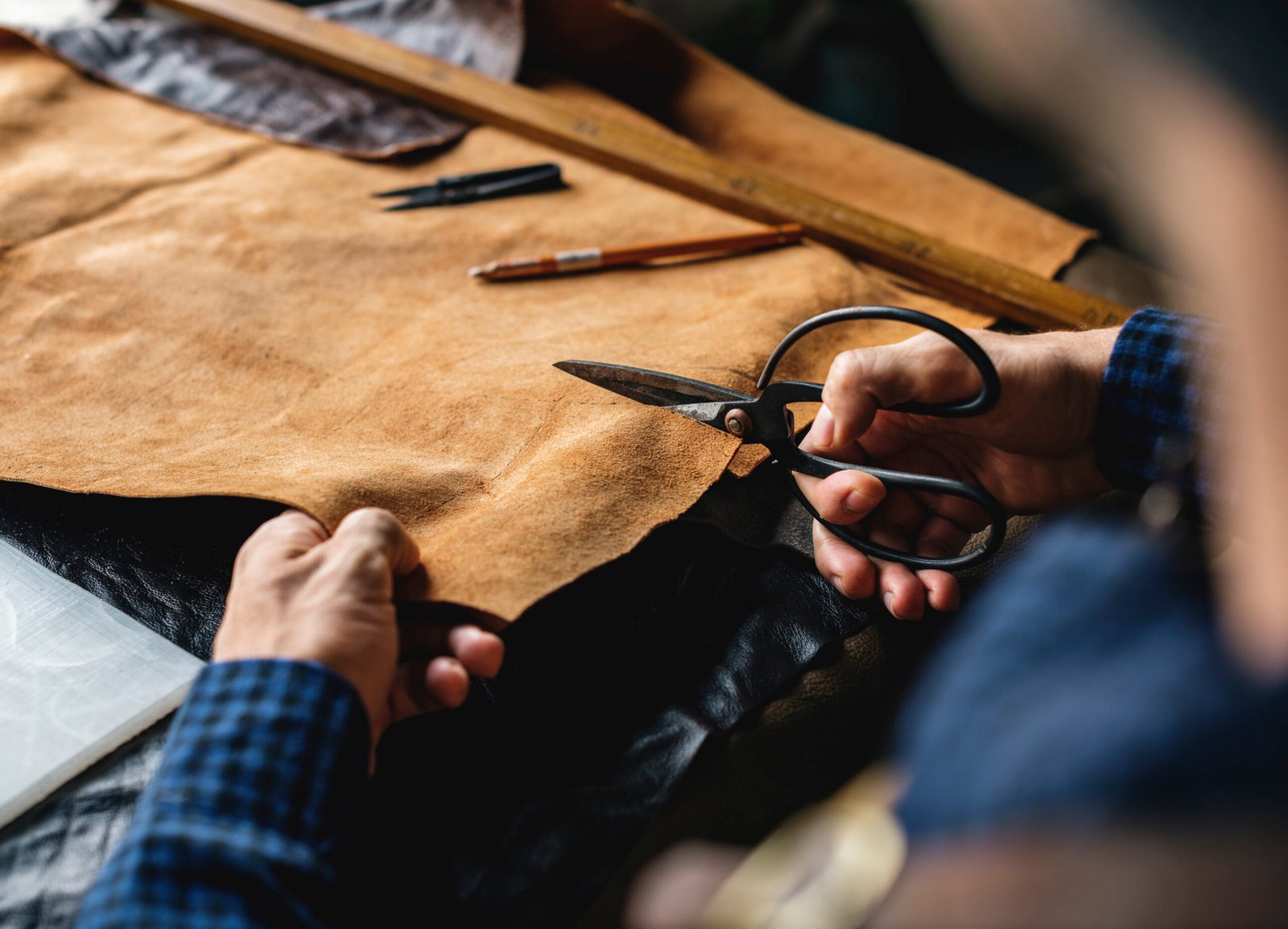 Artisan cutting leather