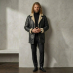 Man wearing Midnight men's black shearling coat from snag leather aesthetic pose