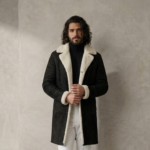 Man wearing Nocturn Men's Black shearling coat by snag leather
