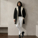 Man wearing Nocturn Men's Black shearling coat by snag leather