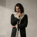 Man wearing Nocturn Men's Black shearling coat by snag leather
