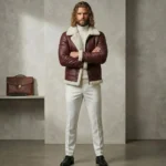 blonde male wearing maroon shearling leather jacket by snag leather